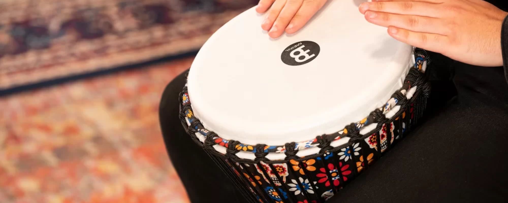 Musician performing on Meinl djembe drum at drum republic drum shop