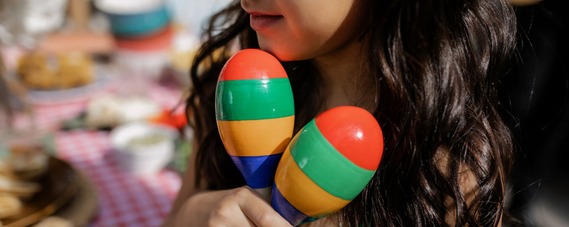 Playing colourful Maracas and Percussion. Available online at Drum Republic 