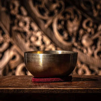 bronze singing bowls displayed in store showing range of sizes and finishes