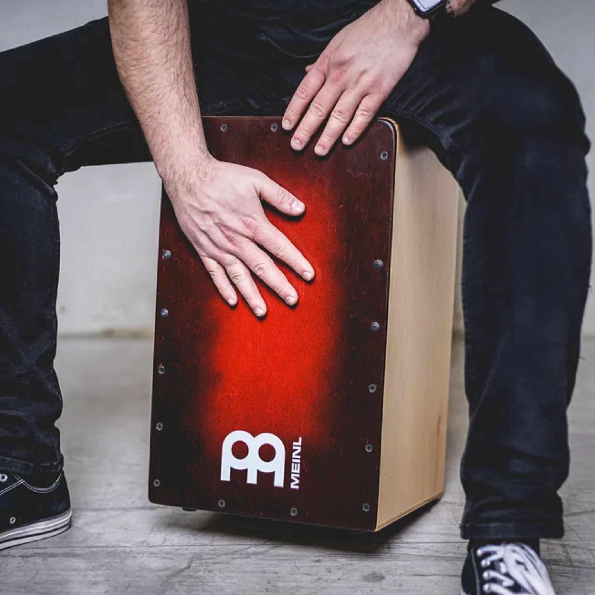 Musician Playing Meinl cajon drum at Drum Republic Drum Shop Australia.