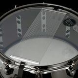 Bottom view of the Tama S.L.P. Black Brass Snare Drum LBR1465 showing the snare-side head, 42-strand carbon steel snare wires, and Black Nickel hoop and hardware.