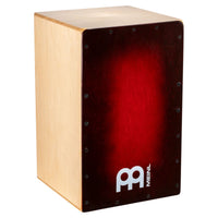 Wooden cajon drum with red interior and Meinl logo on a white background