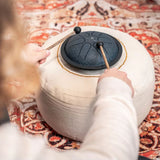 Person playing the navy Meinl Sonic Energy Mini Steel Tongue Drum.