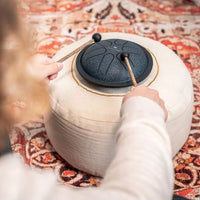 Person playing the navy Meinl Sonic Energy Mini Steel Tongue Drum.