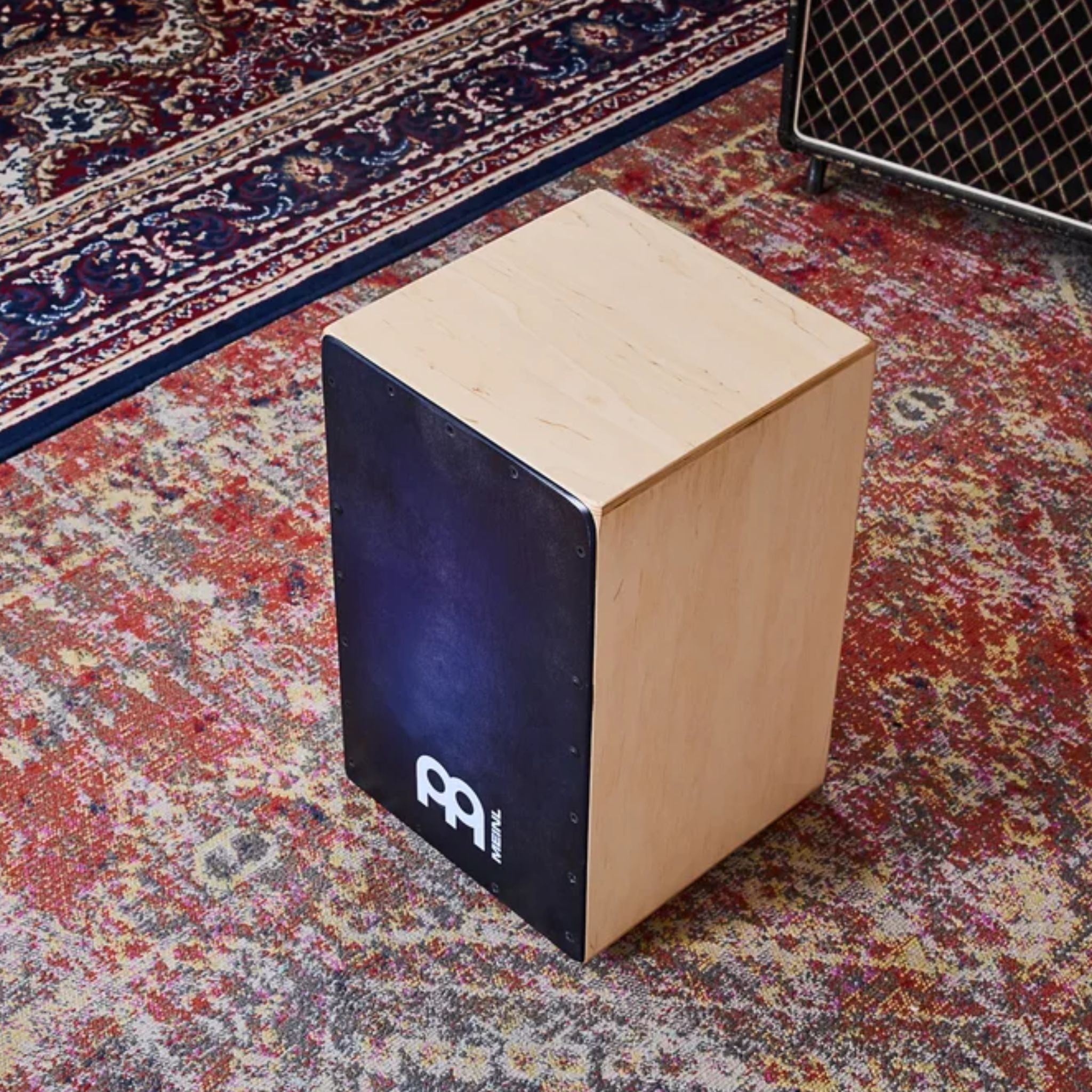 Side angle of the Meinl Snarecraft Cajon displaying Baltic birch construction and Blue Burst frontplate.