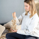 Sound Therapist holding a Sonic Energy Kenari Shaker.