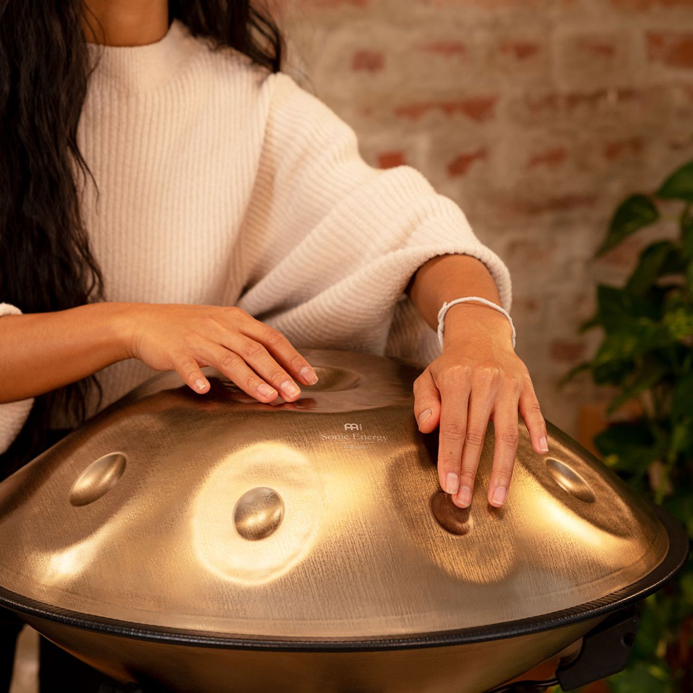 Hands playing a handpan representing sound healing and frequency instruments at Drum Republic, Australia’s modern authority on percussion and sound.