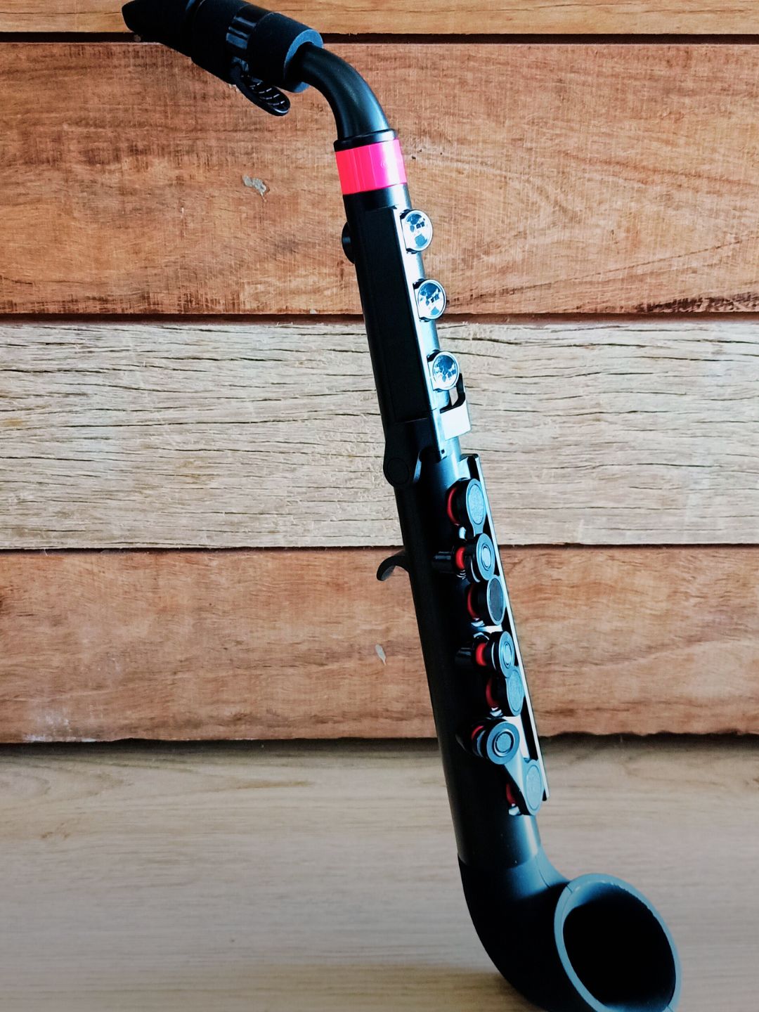 Modern acoustic wind instrument showcasing innovative design and contemporary music craftsmanship.