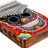Close-up of the Mahalo Kalimba Thumb Piano Handmade Day of the Dead Skull MKA17SK showing the sound hole and handcrafted Day of the Dead Skull artwork.