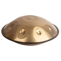 Mano Percussion Handpan 10 Note D Kurd Tuning 55cm Gold displayed on a white background featuring handcrafted stainless steel construction and a 10-note D Kurd scale for meditation, performance, and creative musical exploration.