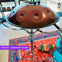 Mano Percussion Universal Handpan Stand DXPHPN displayed in the Drum Republic store with a handpan mounted in the adjustable basket.