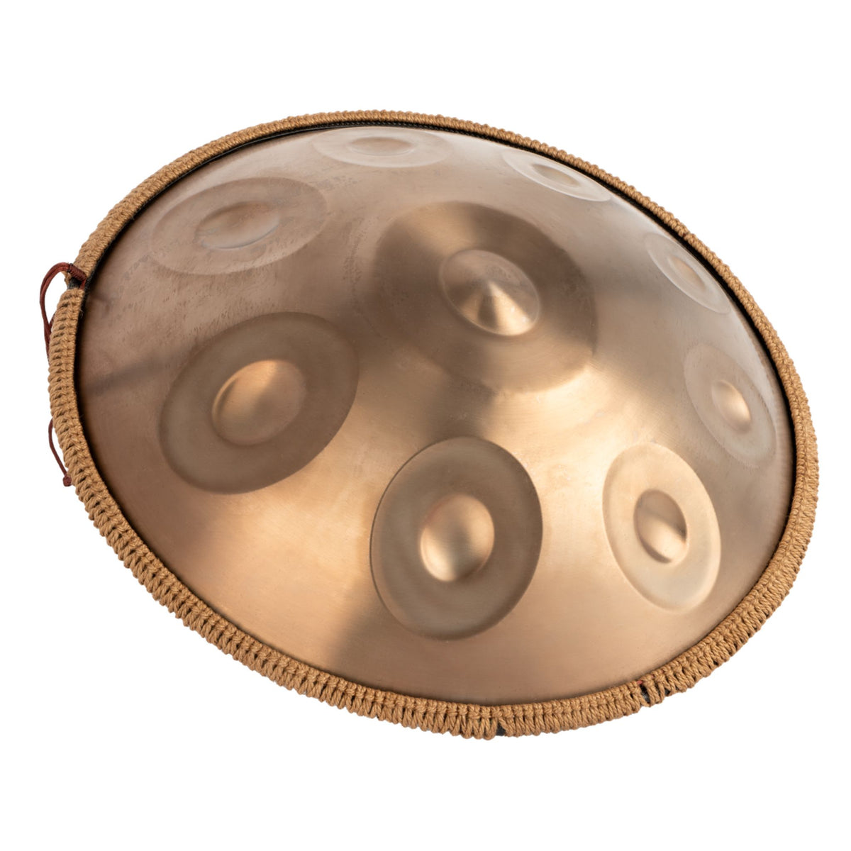 Angled view of the Mano Percussion ManoPan MPC69G 9-note D Kurd handpan showing its gold finish and curved profile.