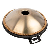 Bottom view of the Mano Percussion ManoPan MPC69G 9-note D Kurd handpan partially visible inside its open carry bag.