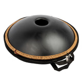 Mano Percussion ManoPan MPC70MBK D Kurd handpan inside its carry bag with the underside of the black handpan visible.