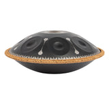 Side view of the Mano Percussion ManoPan MPC70MBK D Kurd handpan showing the black finish and silver mandala artwork.