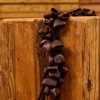 Meinl Bendo Bird Shaker 40 Seeds BI5 resting on wooden block showing natural Bendo seed nutshells and organic handcrafted design inspired by nature and percussion sounds