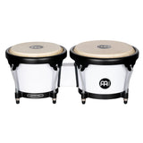 Meinl Journey Series bongo drums in white finish, compact paired bongos with natural drumheads and black hardware, front view on white background.