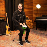 Musician playing Meinl Junior Djembe Drum 7 inch Green JRD-G in a studio setting