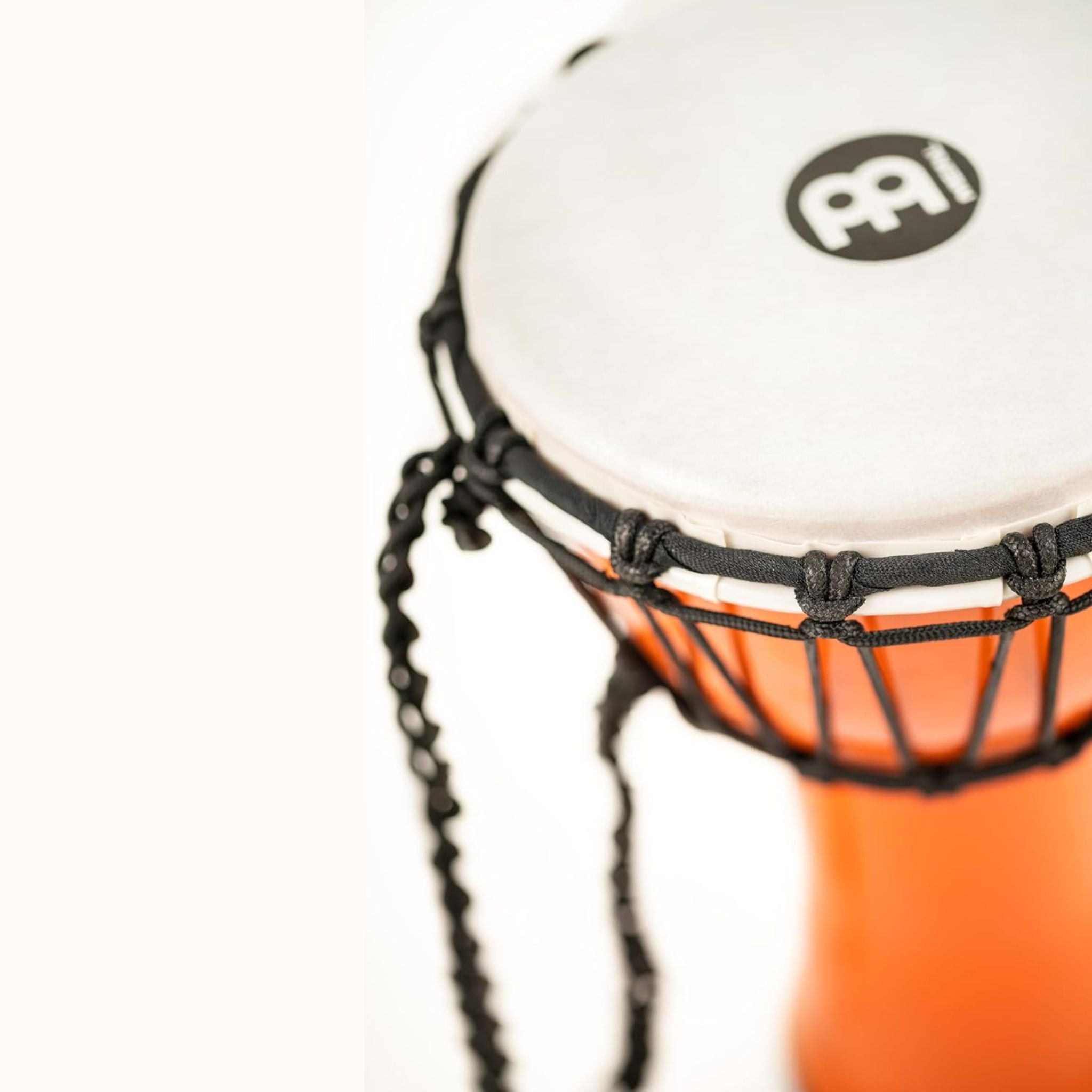 Detail of pre-stretched rope tuning on the Meinl Junior Djembe Drum 7 inch Orange JRD-O