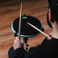 drummer playing Meinl Marshmallow Practice Pad 12 inch Sea Foam MMP12SF mounted on stand for quiet practice and technique development