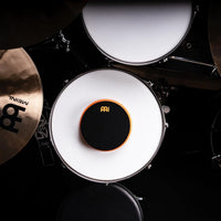 Meinl Marshmallow Practice Pad 6 inch Orange MMP6OR placed on snare drum within drum kit setup for quiet practice, stick control, and technique development