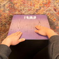 POV of a musician playing the Meinl Snare Cajon Headliner Series Lilac Purple Fade MCAJ100BK-LPF — hands striking the drum, highlighting expert technique and professional percussion performance.
