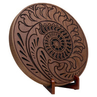 15 inch rain disk with Fibonacci-inspired carving on wooden stand against white background showing natural carved surface detail