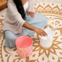 close up of woman playing the Meinl Sonic Energy 3-Piece Essence Crystal Singing Bowl Set E4 B3 G3 440Hz ECSBSETEBG showing crystal bowls, silicone rod technique, and rich resonant tones used for meditation, sound therapy, and mindfulness practice.