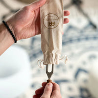 Meinl Sonic Energy Earth Year Therapy Tuning Fork 136.10 Hz TTF-E being removed from its protective storage pouch.