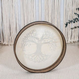 rear view of Meinl Sonic Energy Frame Drum 16 inch Tree of Life HD16WB-TOL resting on floor in calm setting showing Siam Oak frame construction and hand grip design