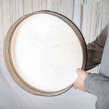 man holding Meinl Sonic Energy Frame Drum 16 inch Tree of Life HD16WB-TOL showing rear frame construction and comfortable hand grip design