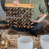 Close-up of Meinl Sonic Energy mixed seed chimes held during a sound bath session showing natural seed craftsmanship