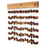 Meinl Sonic Energy Pala Chimes SPCH featuring natural Pala seed nutshells mounted on a solid mahogany bar.