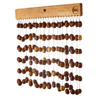 Meinl Sonic Energy Pala Chimes SPCH featuring natural Pala seed nutshells mounted on a solid mahogany bar.