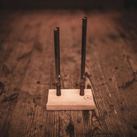 Meinl Sonic Energy Planetary Therapy Tuning Fork Day & Night Set TTF-SET-2 displayed with the wooden holder on a rustic wooden surface.