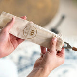 Meinl Sonic Energy therapy tuning fork stored inside its protective fabric pouch.