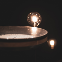 Meinl Sonic Energy Wave Drum 16-inch walnut brown displayed in warm lighting, perfect for meditation, sound healing, and relaxation.