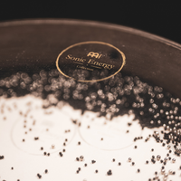 Meinl Sonic Energy Wave Drum 16-inch in walnut brown with steel balls on transparent head creating relaxing ocean wave sounds.