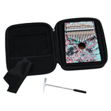 open carrying case containing Meinl Sound Hole Designer Kalimba Coral Reef KA17CR with included tuning hammer and microfiber cleaning cloth for storage, maintenance, and transport.