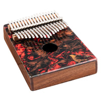 Meinl Sound Hole Designer Kalimba Lava KA17LV from angled perspective highlighting chrome-plated steel tines, sound hole design, and decorative lava finish on acacia wood body