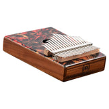 side angled view of Meinl Sound Hole Designer Kalimba Lava KA17LV displaying 17-note C Major tuning, resonant sound hole, and lava-inspired artwork for melodic music making and relaxation