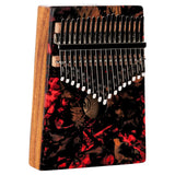 Meinl Sound Hole Designer Kalimba Lava KA17LV on white background featuring 17-note C Major tuning, acacia wood body, chrome-plated steel tines, and lava-inspired artwork for melodic sound exploration and relaxation.