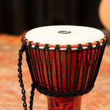 Meinl Travel Series Djembe Drum 10" Pharaoh's Script PADJ1-M-F in a studio setting, showing the upper shell and rope-tuned synthetic head.
