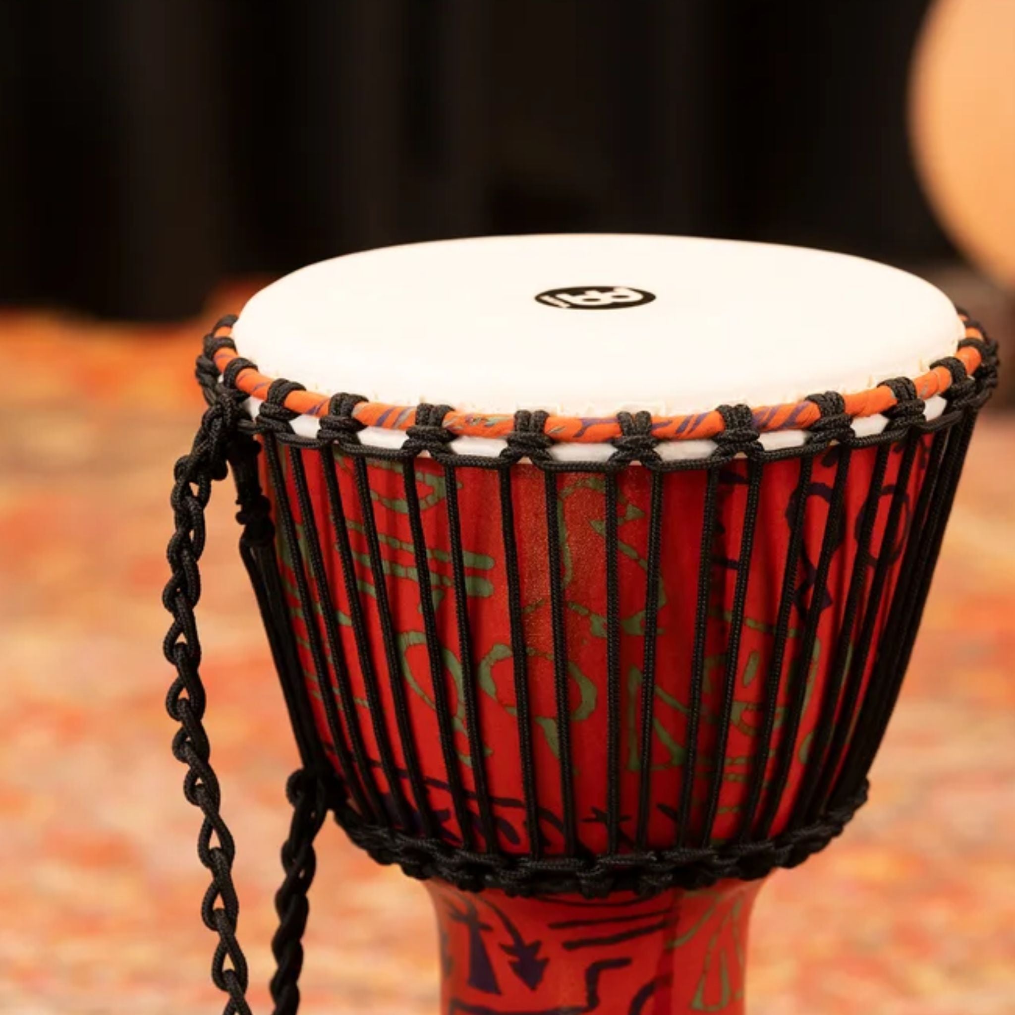 Meinl Travel Series Djembe Drum 10" Pharaoh's Script PADJ1-M-F in a studio setting, showing the upper shell and rope-tuned synthetic head.