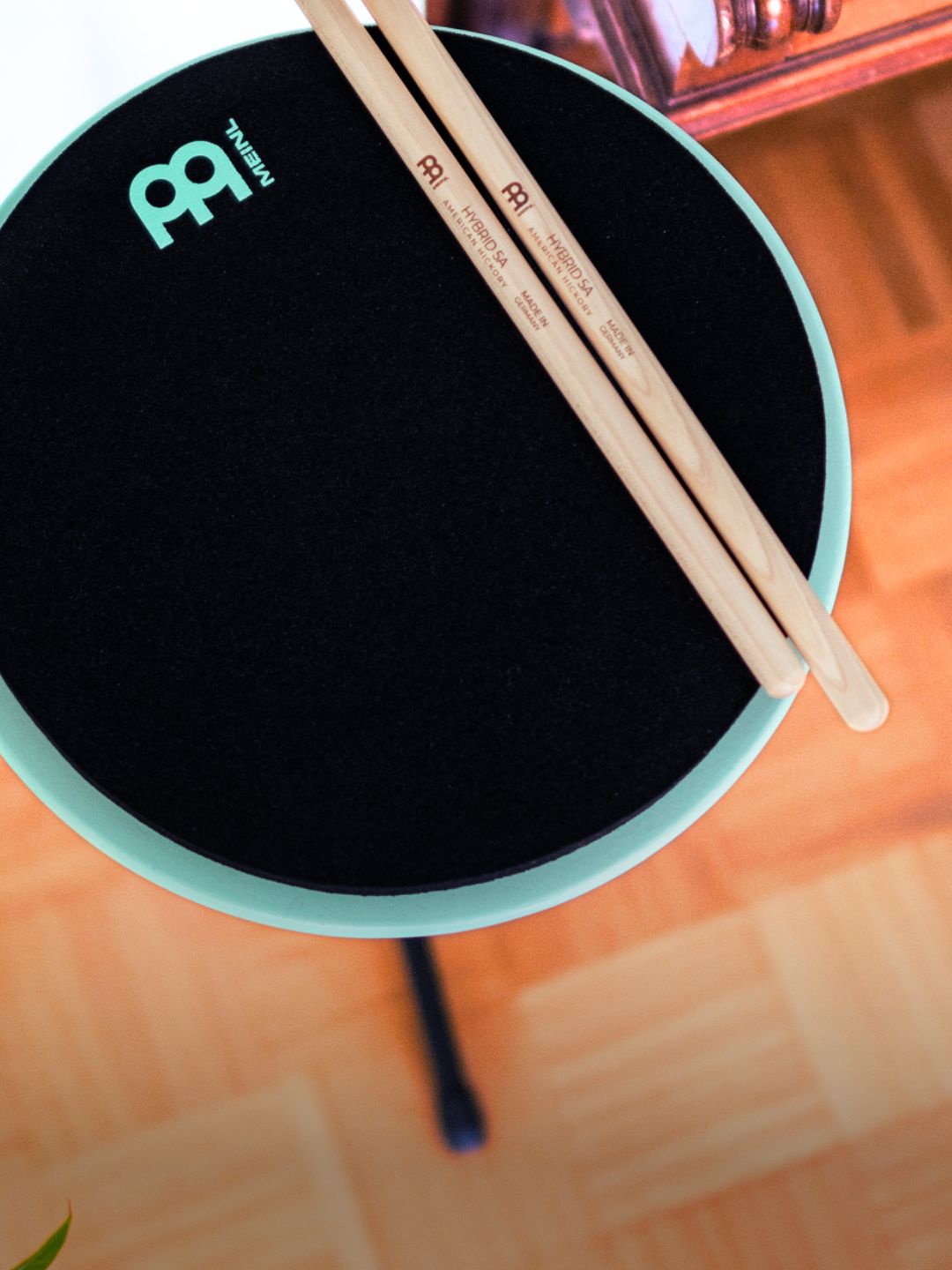 Modern percussion practice setup featuring drumsticks on a professional practice pad, representing new inspiration in contemporary percussion and musical instrument.