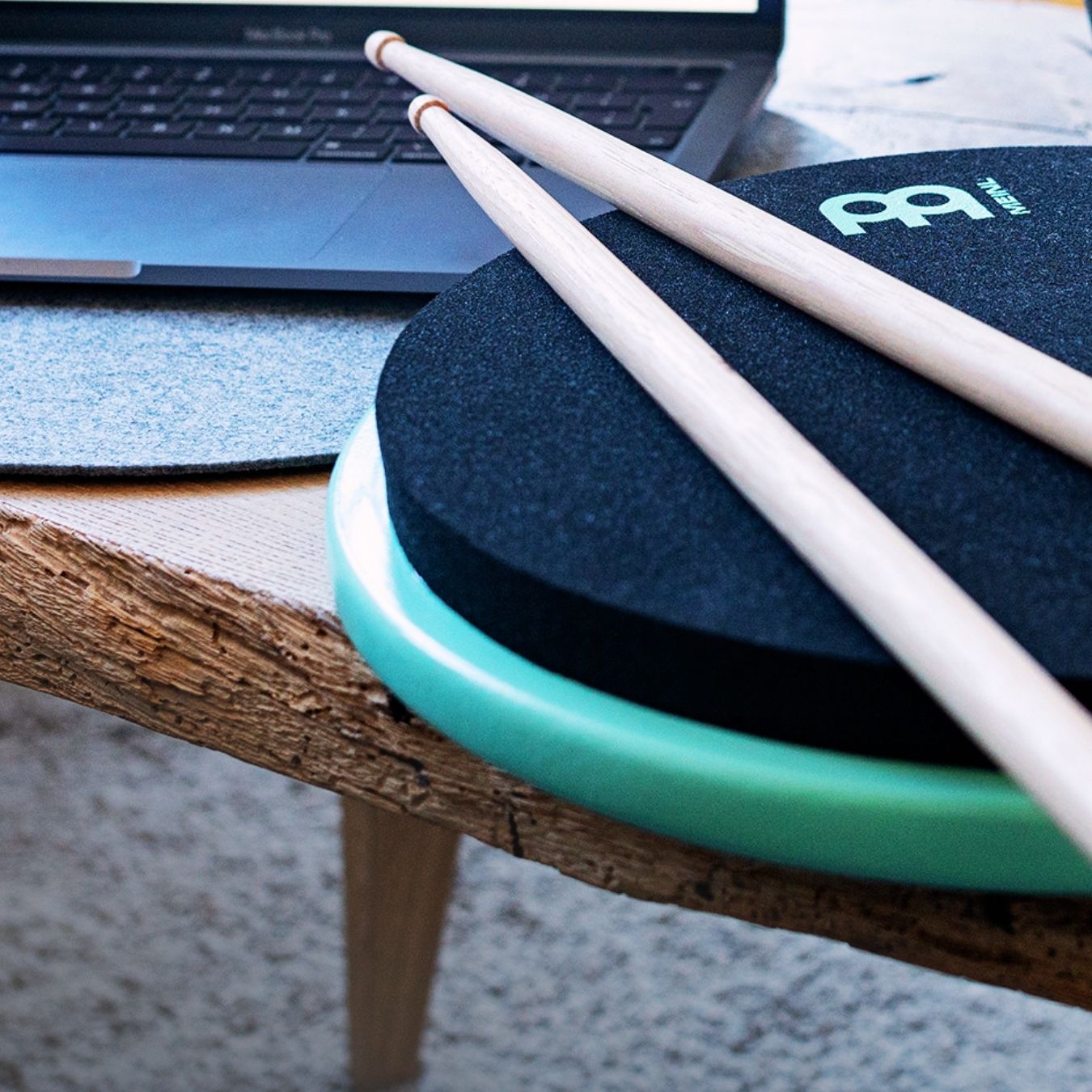 Modern percussion practice setup featuring drumsticks on a professional practice pad, representing new inspiration in contemporary percussion.
