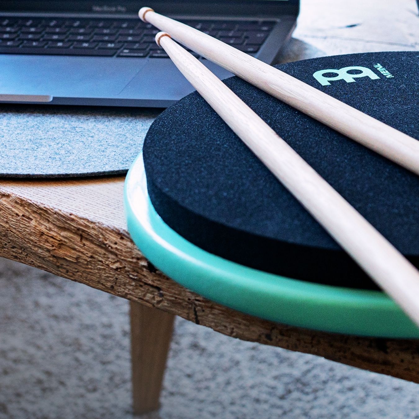 Modern percussion practice setup featuring drumsticks on a professional practice pad, representing new inspiration in contemporary percussion.