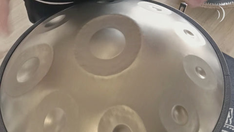 Mano Percussion ManoPan gold handpan being played, demonstrating its warm resonant tone and sustained sound.