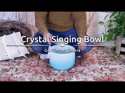 large silicone rod being used on crystal singing bowl to demonstrate smooth sustained resonance and controlled tonal response