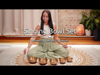 resonant suede leather mallet being used on metal singing bowl to create continuous sustained tone through rim playing for meditation and sound therapy